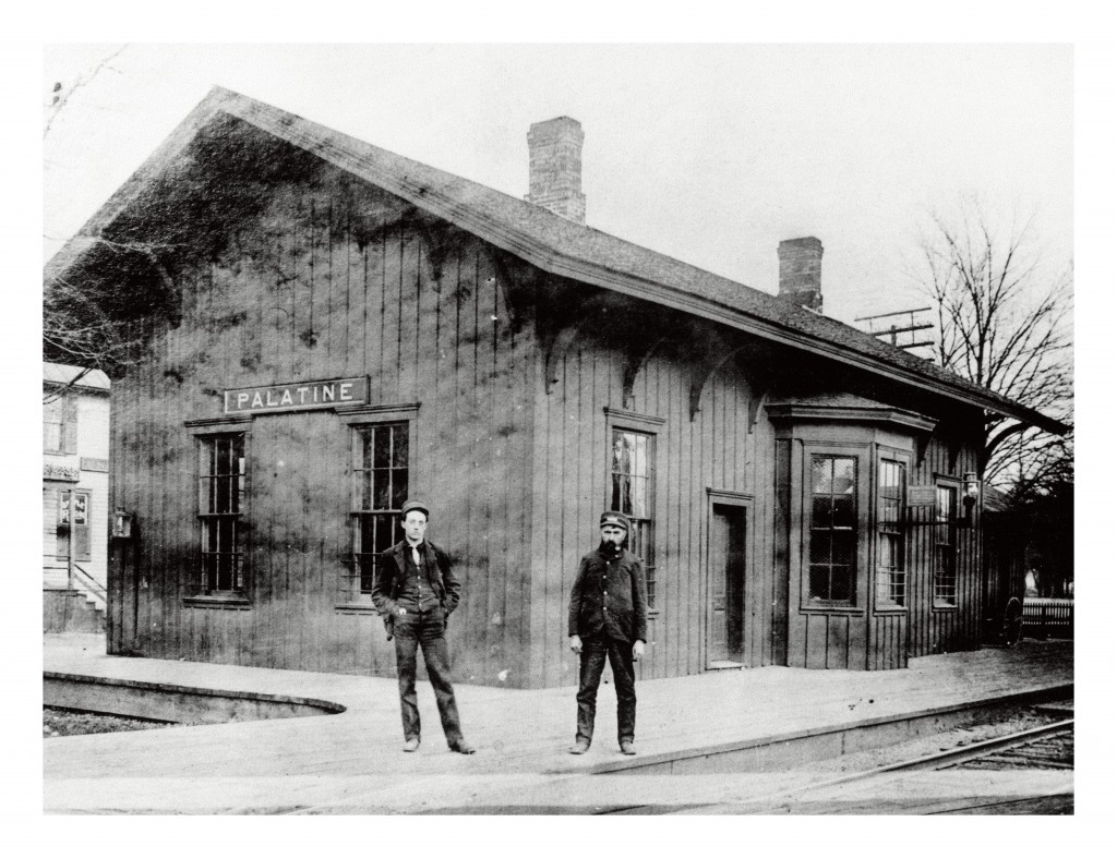 The depot was built circa 1855 by Hiram Thurston on land donated by Joel Wood. It was on the north side of the tracks.